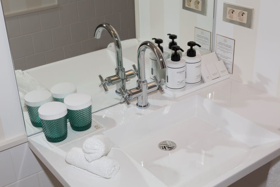 Family Suite, Accessible, City View | Bathroom | Eco-friendly toiletries, hair dryer, bathrobes, slippers