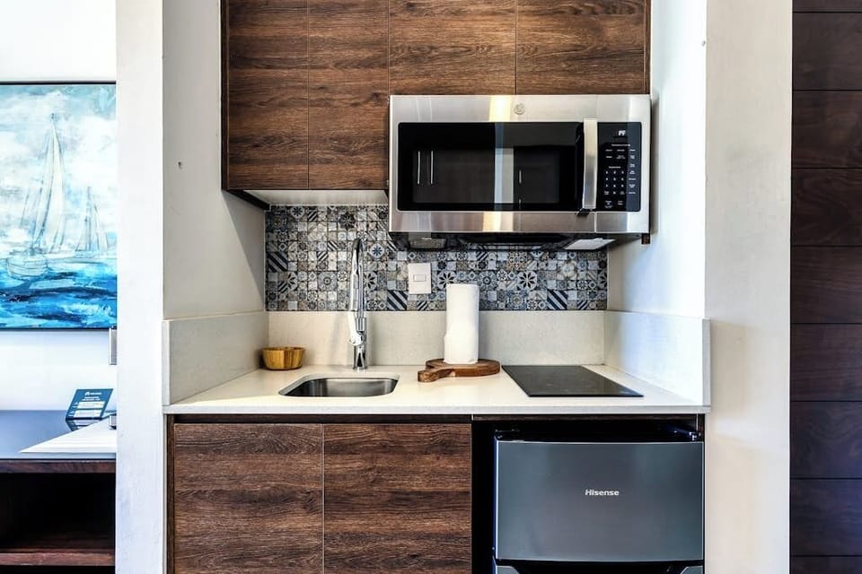 Studio, 1 Queen Bed, City View (Carmely Velas Paradise # 2403A) | Private kitchen