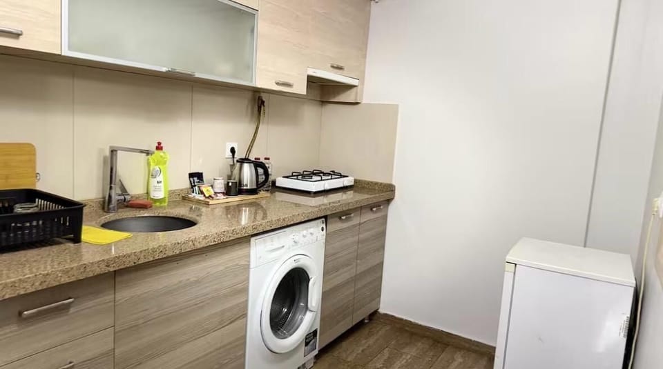 Family Condo | Private kitchen | Fridge, electric kettle, cleaning supplies, paper towels
