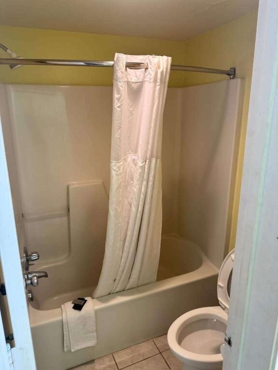 Bathtub, towels, soap, shampoo