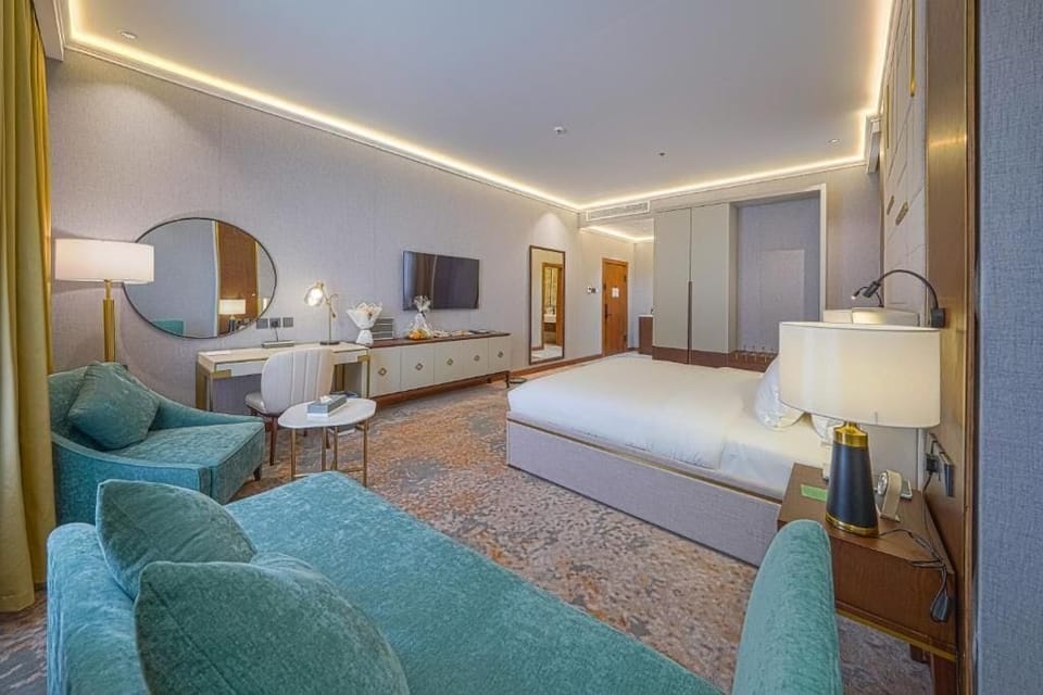 Junior Suite, City View | In-room safe, soundproofing, iron/ironing board, free WiFi