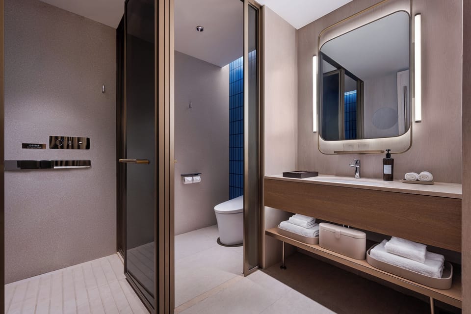 Shower, rainfall showerhead, designer toiletries, hair dryer
