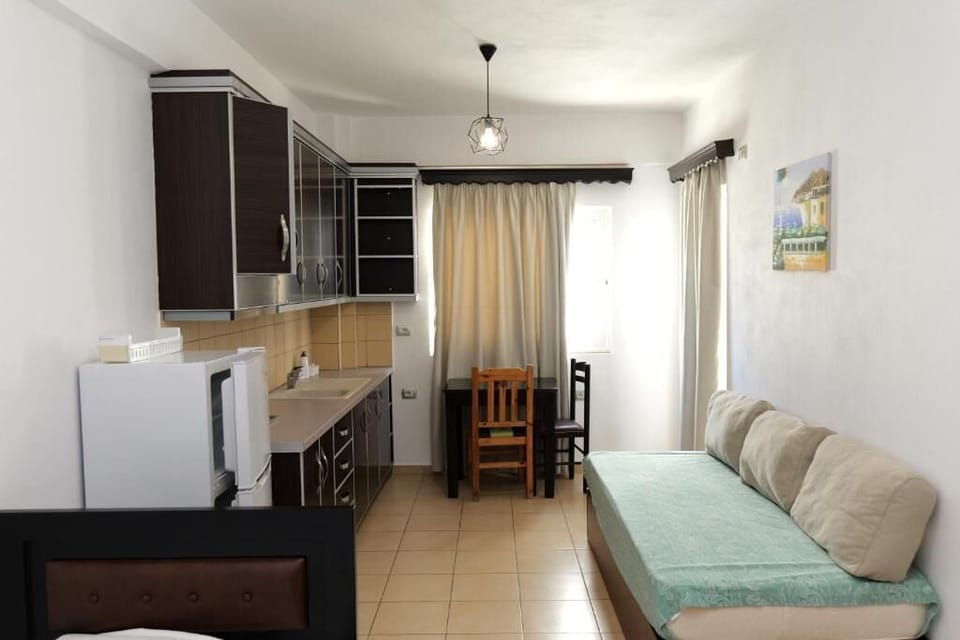 Apartment, Balcony, Sea View | Private kitchenette | Fridge, electric kettle, dining tables