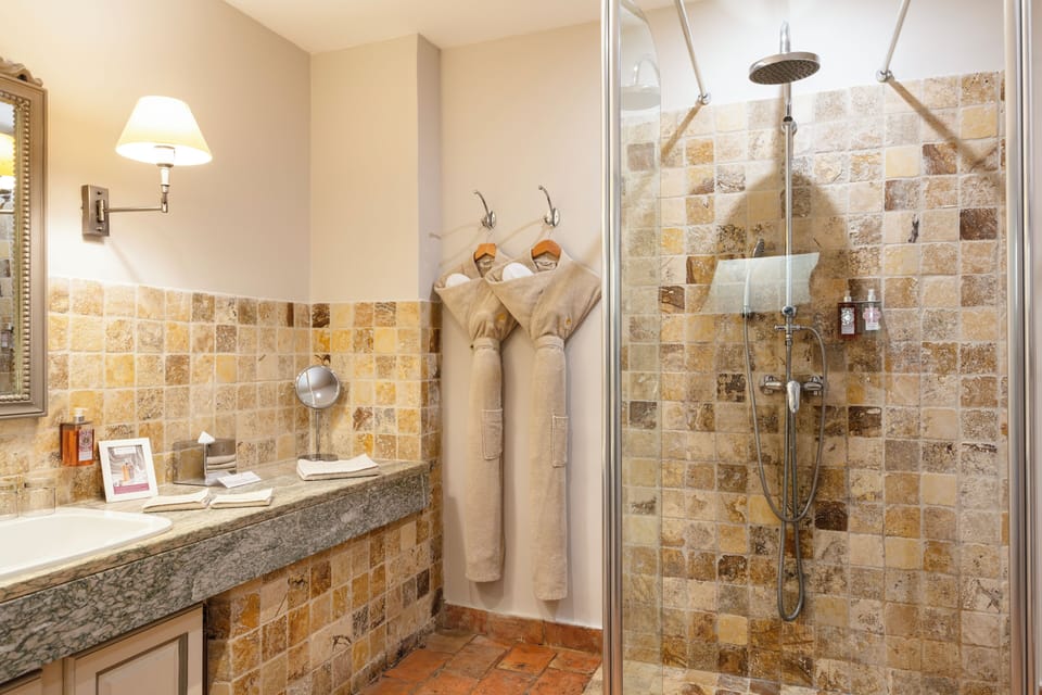 Hydromassage showerhead, free toiletries, hair dryer, bathrobes