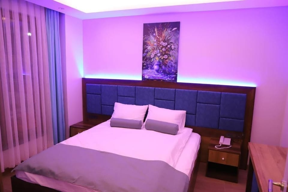 Deluxe Suite, Balcony, Mountain View | In-room safe, blackout drapes, soundproofing, iron/ironing board