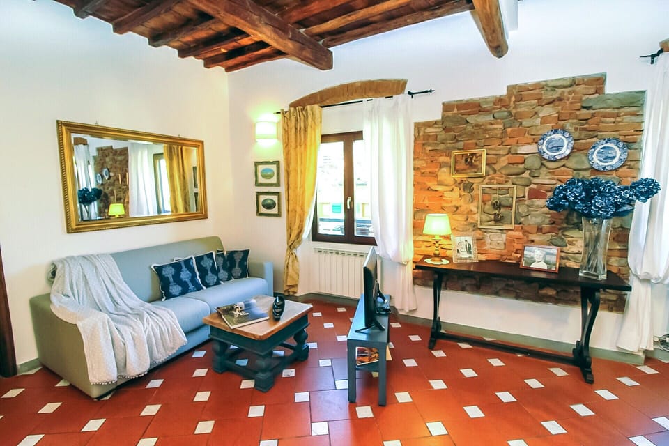 Apartment | Living area | 30-inch flat-screen TV with satellite channels