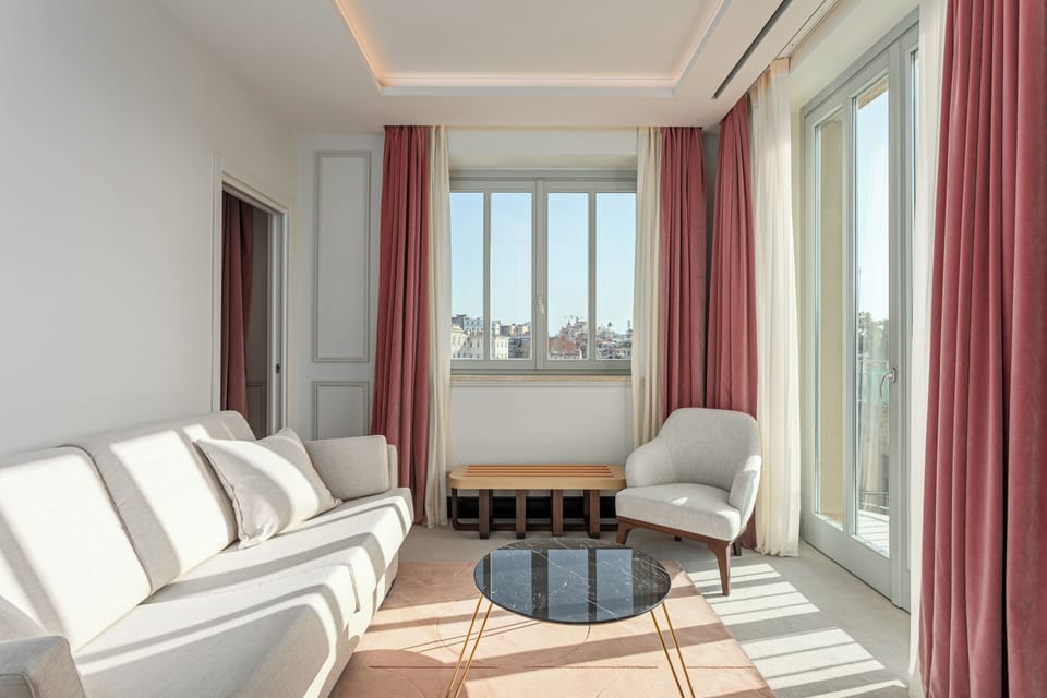 Superior Suite | Living area | 34-inch plasma TV with cable channels