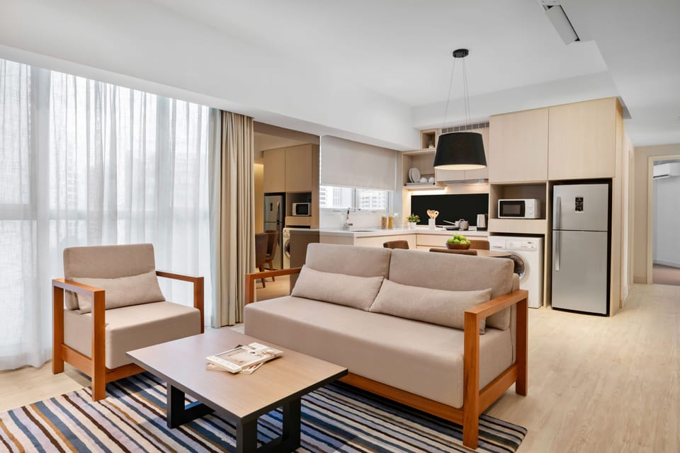 Two Bedrooms Premier Suite | Living area | 42-inch LED TV with cable channels, TV, DVD player