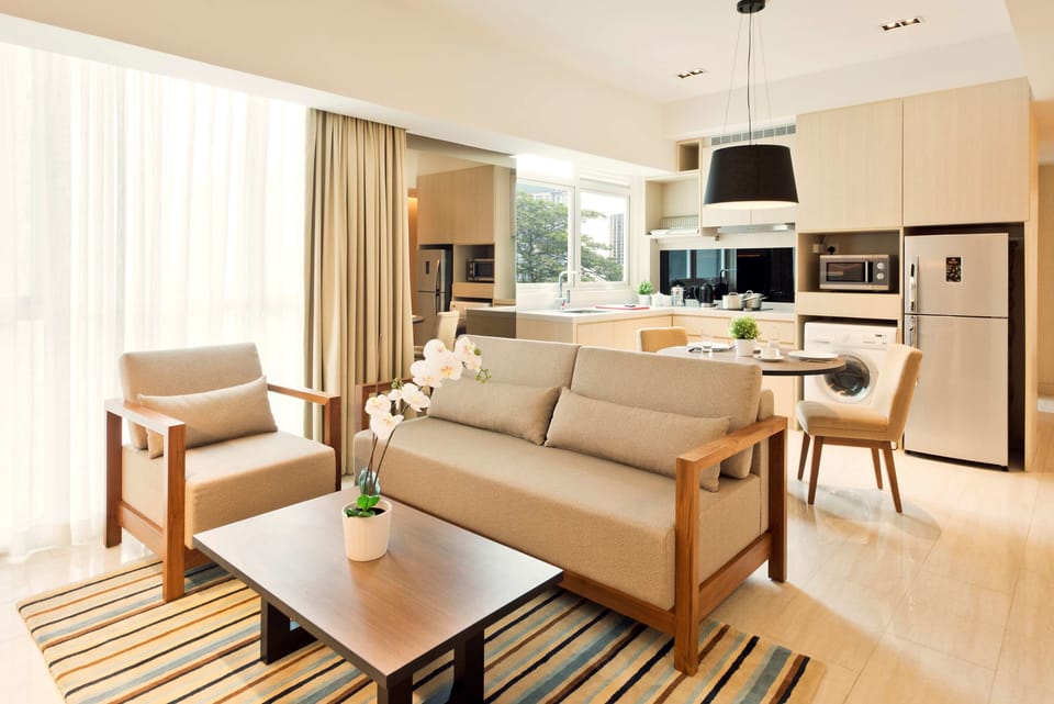 Family Suite | Living room | 42-inch LED TV with cable channels, TV, DVD player