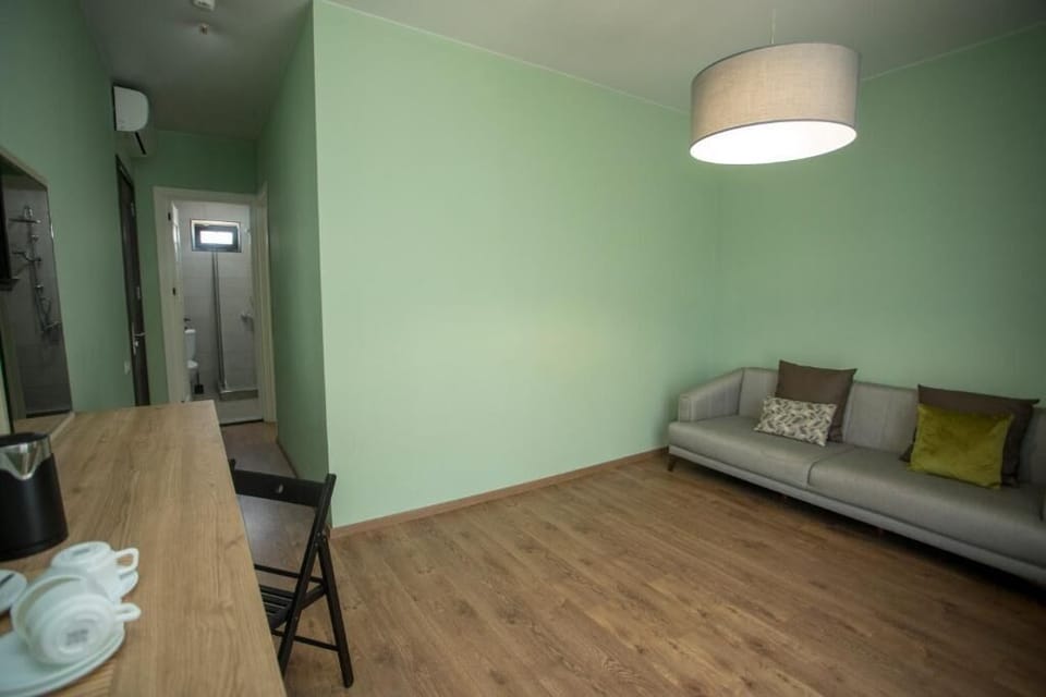 Family Room, Balcony, Sea View | Living area | 45-inch flat-screen TV with cable channels