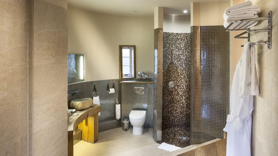 Rainfall showerhead, designer toiletries, hair dryer, bathrobes