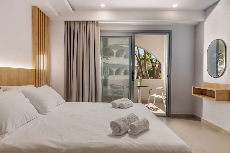 Deluxe Suite, 2 Bedrooms, Garden View, Ground Floor | In-room safe, desk, blackout drapes, iron/ironing board