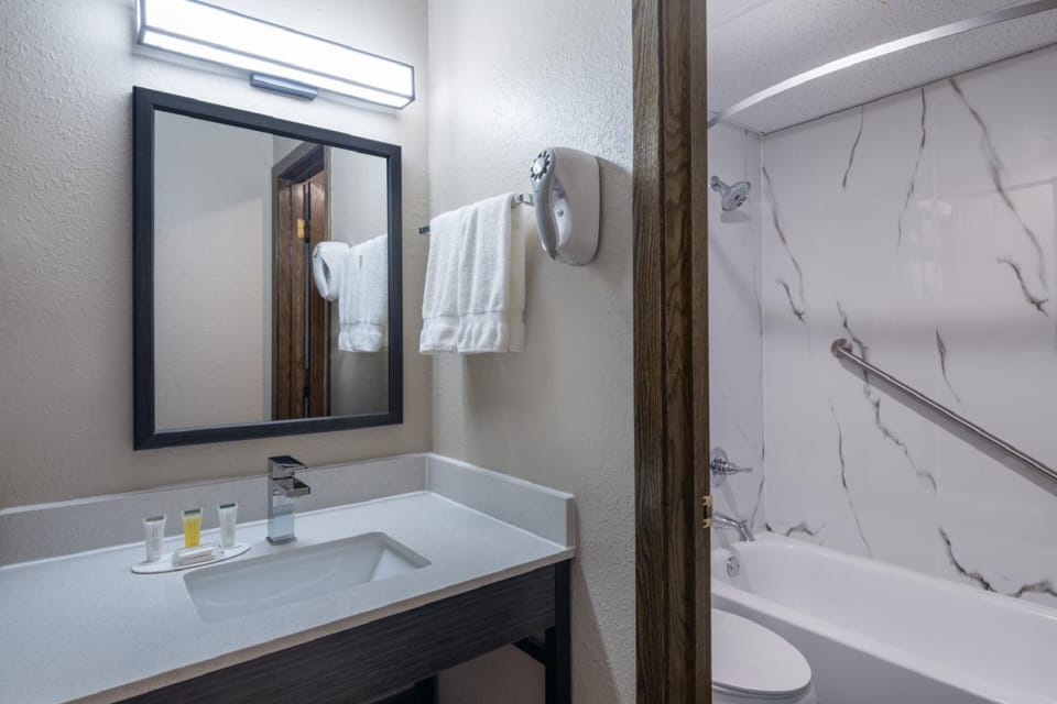 Separate tub and shower, towels, toilet paper