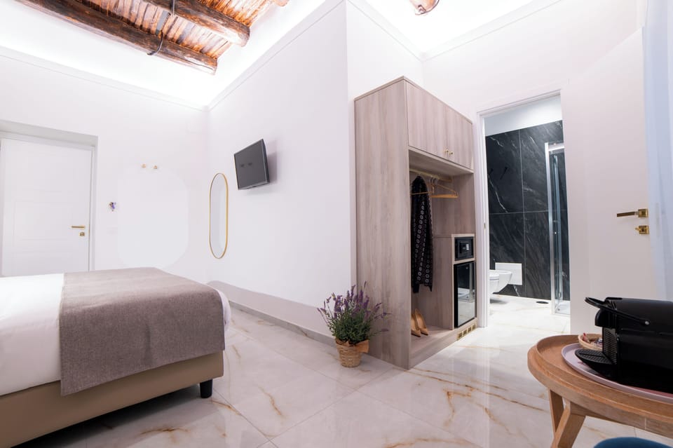 Deluxe Triple Room, City View | In-room safe, blackout drapes, iron/ironing board, free WiFi