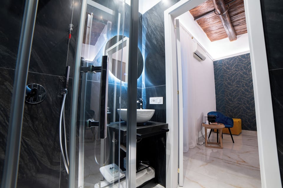 Deluxe Triple Room, City View | Bathroom | Shower, hair dryer, towels, soap