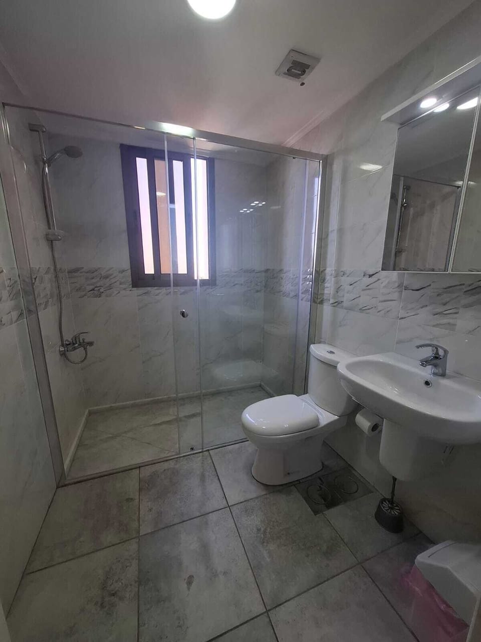 Shower, towels, soap, toilet paper