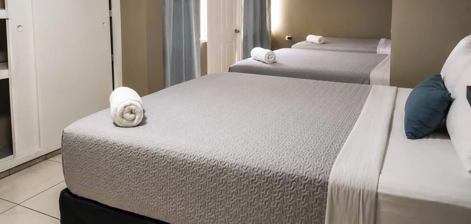 Family Room, Multiple Beds, Smoking, Housekeeping | Down comforters, Select Comfort beds, desk, WiFi (free)