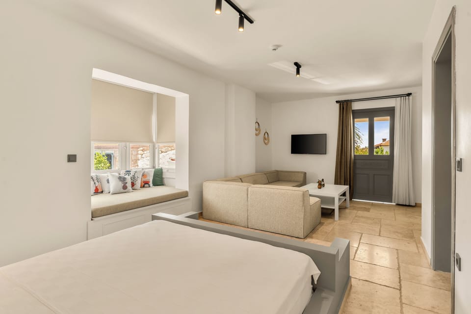 Junior Suite, Balcony, Pool View | Minibar, in-room safe, desk, laptop workspace