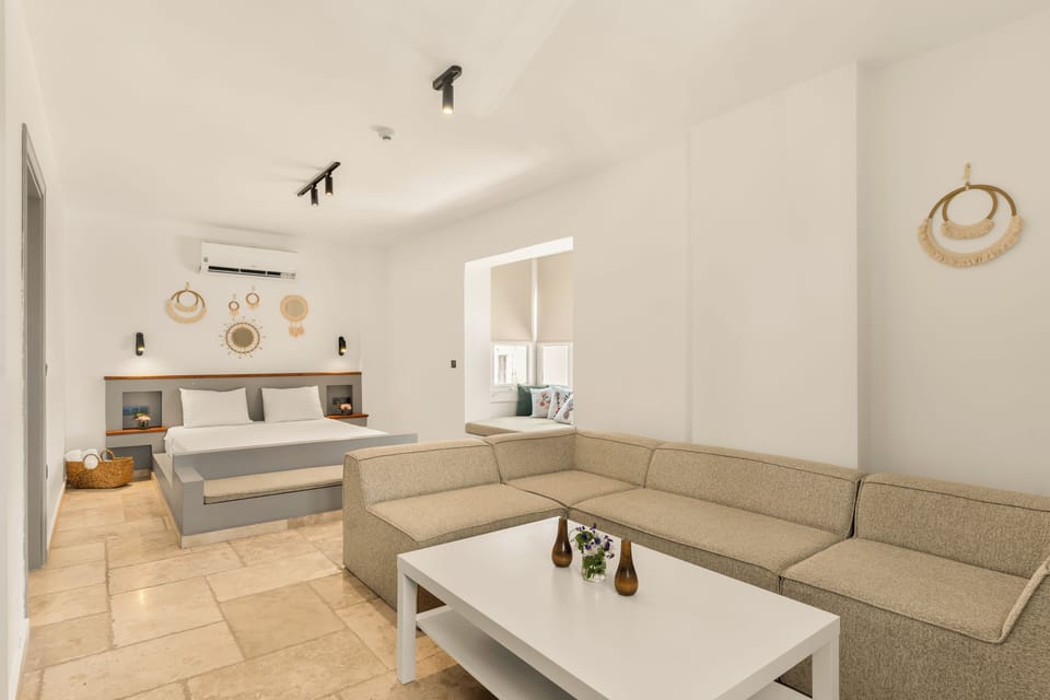 Junior Suite, Balcony, Pool View | Minibar, in-room safe, desk, laptop workspace