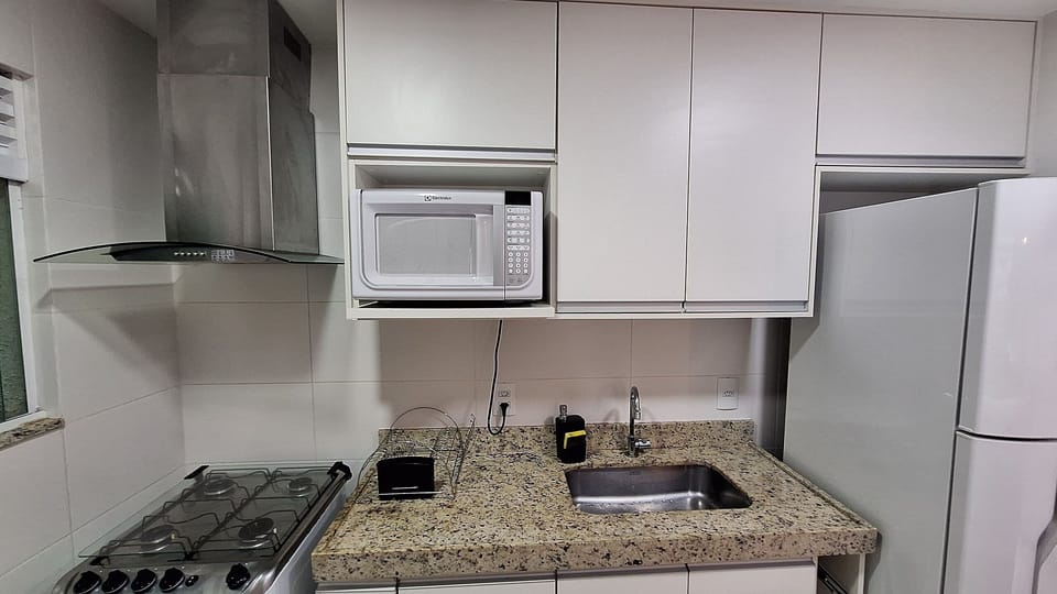 Basic Apartment | Private kitchen | Electric kettle, dining table