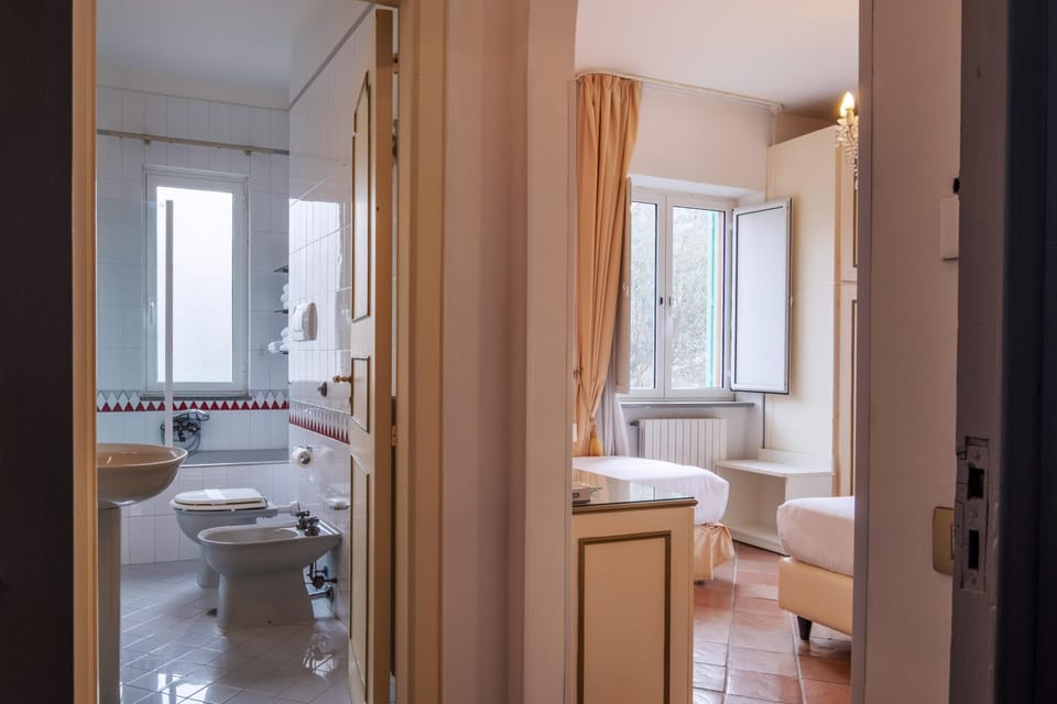 Triple Room, 1 Double Bed with Sofa bed, Balcony | Bathroom | Hair dryer, towels, soap, shampoo