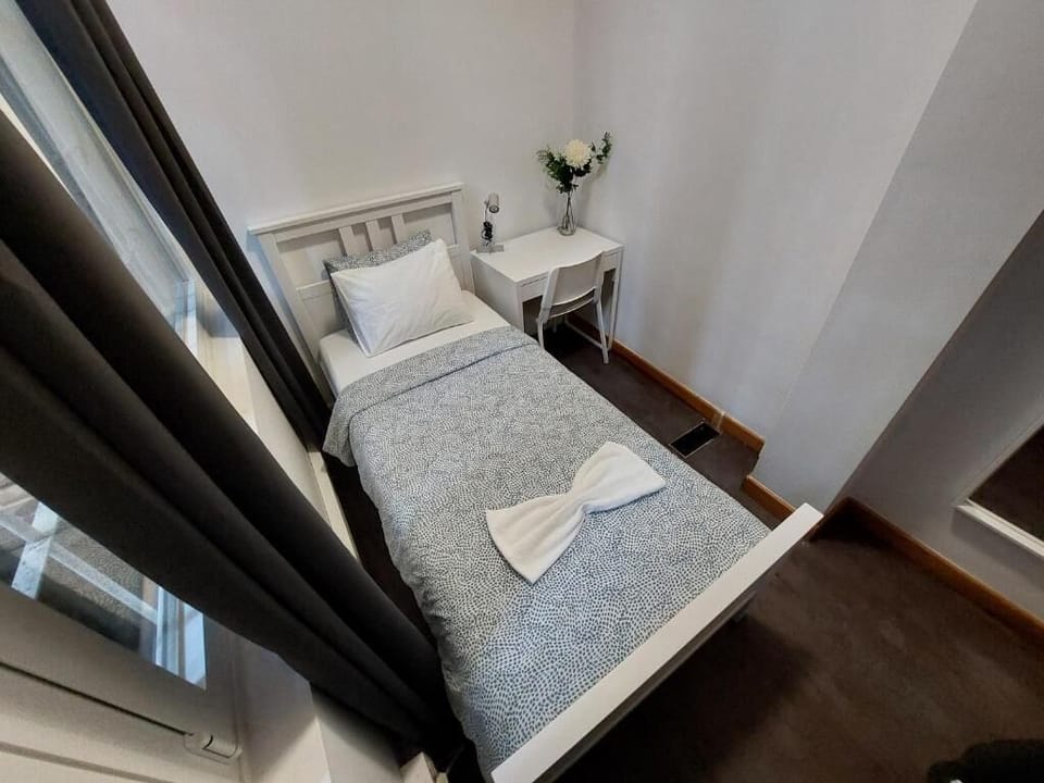 Single Room, City View | Down comforters, free WiFi