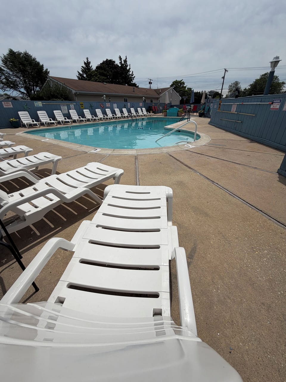Seasonal outdoor pool, open 9:00 AM to 10:00 PM, pool umbrellas