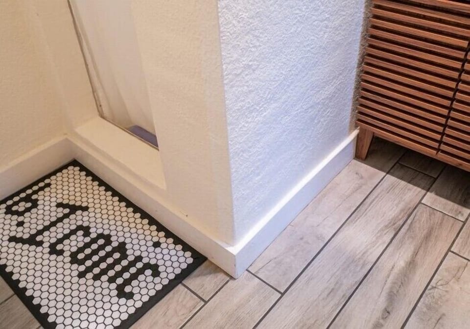 b. iconic | Bathroom | Shower, rainfall showerhead, hair dryer, bidet