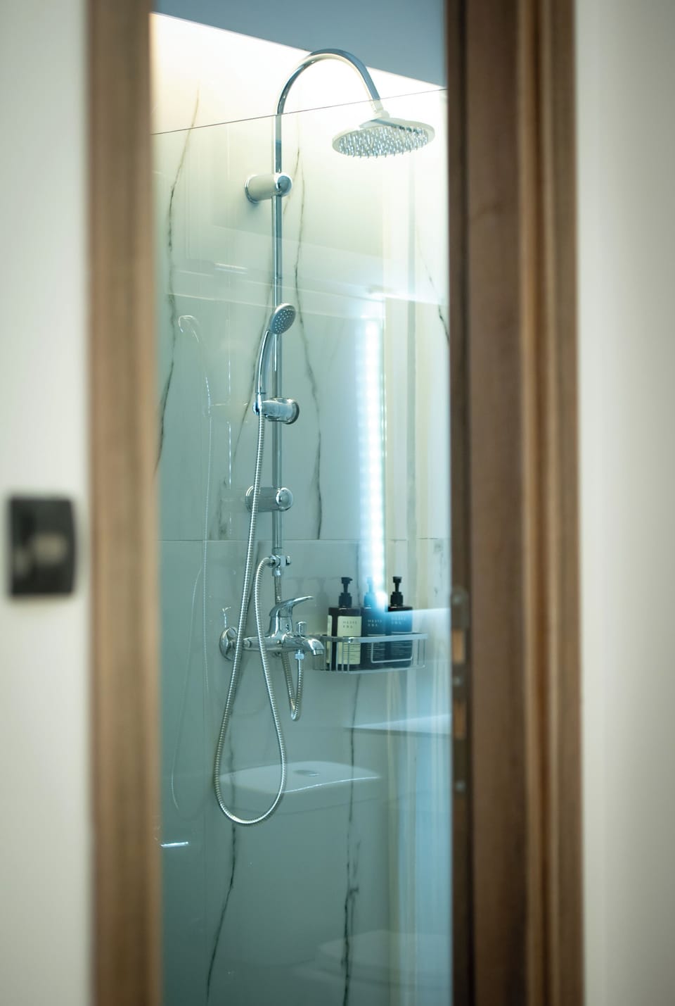 Deluxe Quadruple Room, Balcony | Bathroom | Shower, hair dryer, towels, soap