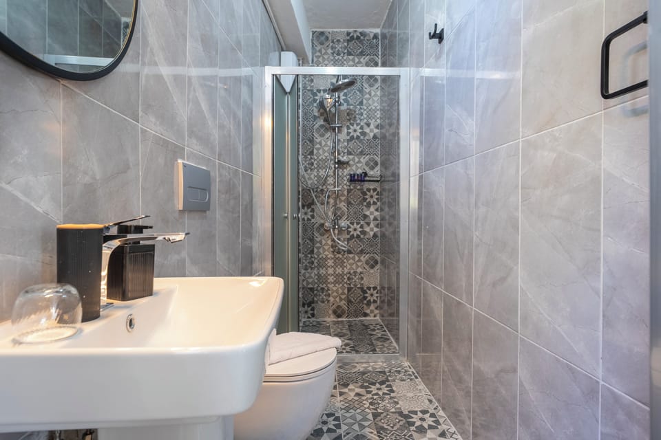Shower, hair dryer, slippers, towels