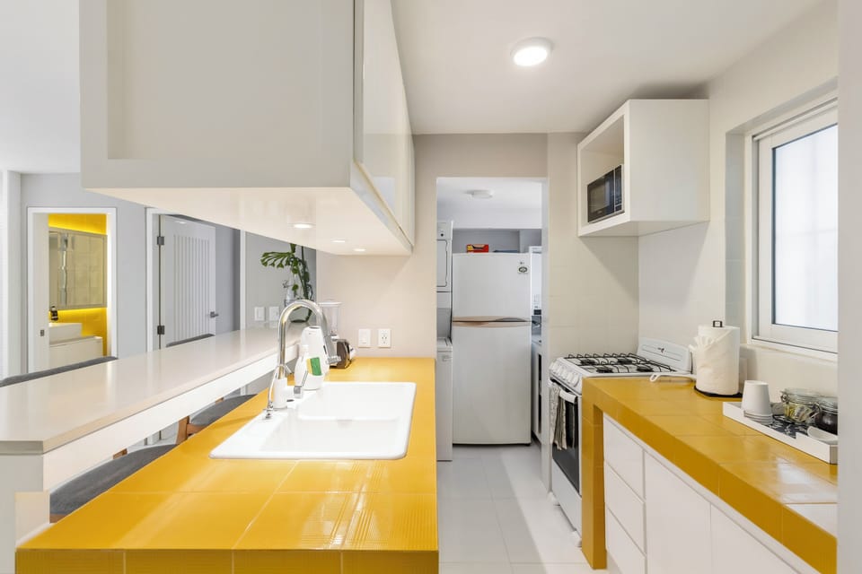 Comfort Condo | Private kitchen | Coffee/tea maker, toaster, blender, cleaning supplies