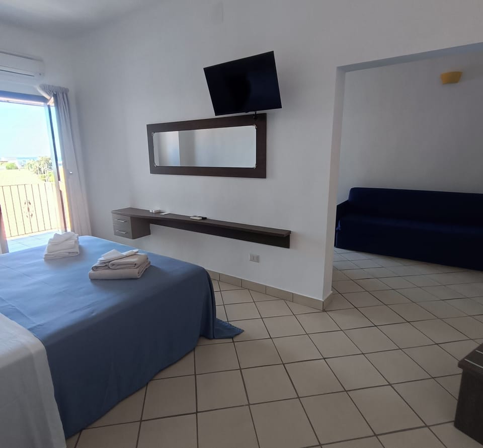 Junior Suite, Balcony, Partial Ocean View | In-room safe, blackout drapes, iron/ironing board (on request)