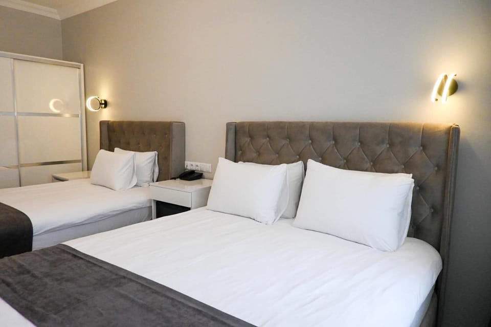 Family Room, Balcony, City View | Free WiFi