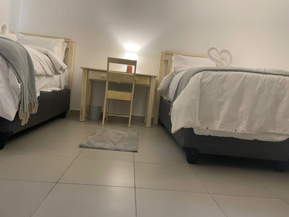Deluxe Bungalow, Garden View | In-room safe, desk, laptop workspace, iron/ironing board
