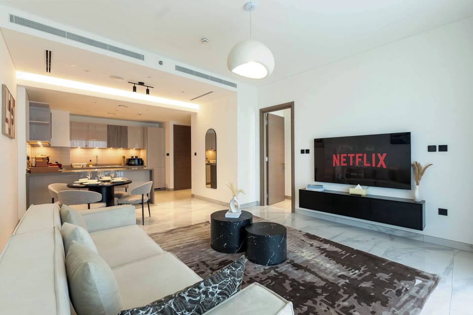 Deluxe Apartment, Balcony, Pool View | Living area | 57-inch flat-screen TV with satellite channels