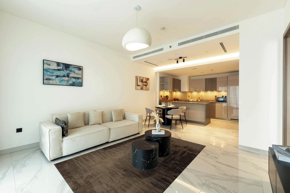 Deluxe Apartment, Balcony, Pool View | Living area | 57-inch flat-screen TV with satellite channels