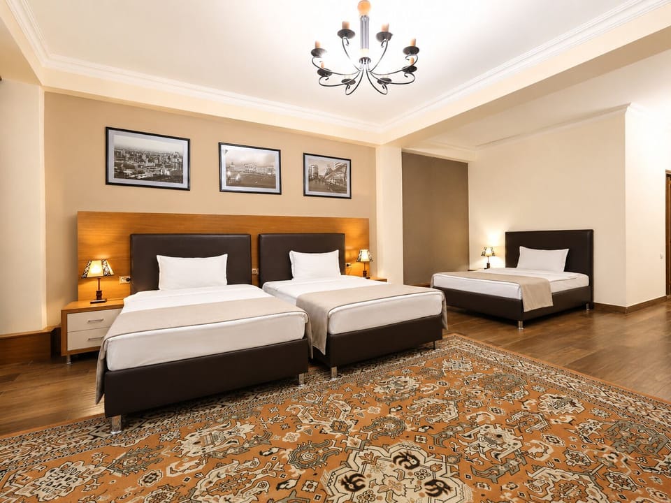 Deluxe Triple Room | In-room safe, desk, laptop workspace, iron/ironing board
