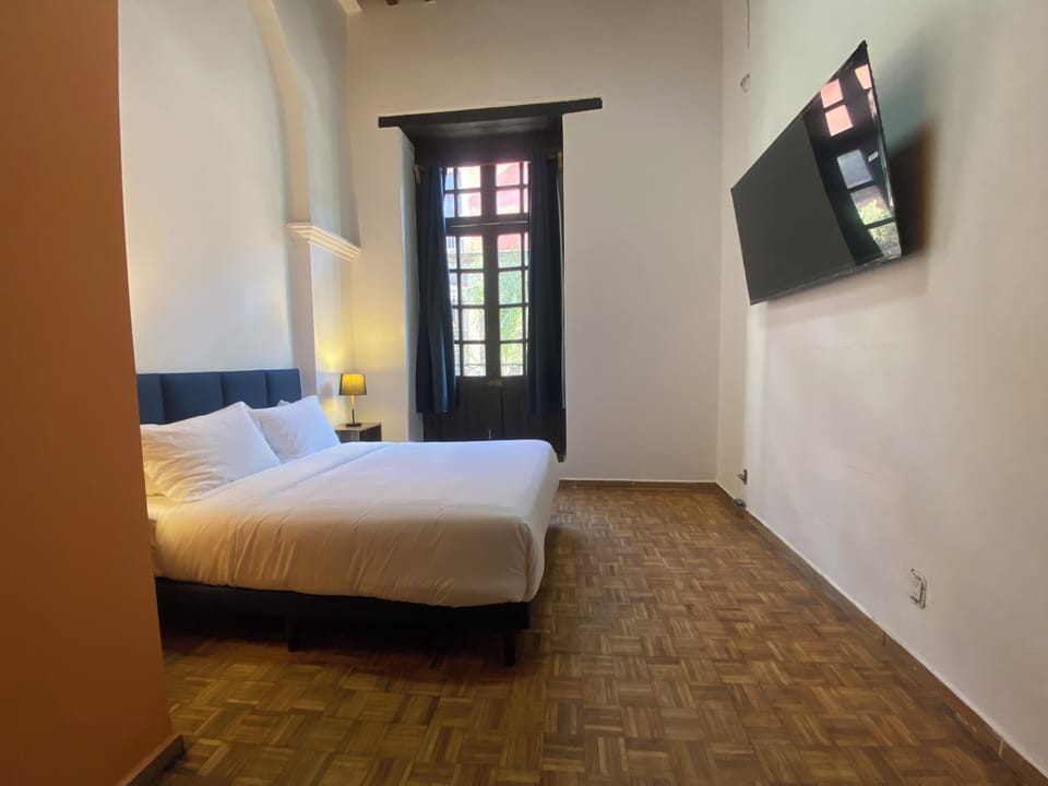 Basic Double Room, Balcony, City View | Iron/ironing board, free WiFi, bed sheets