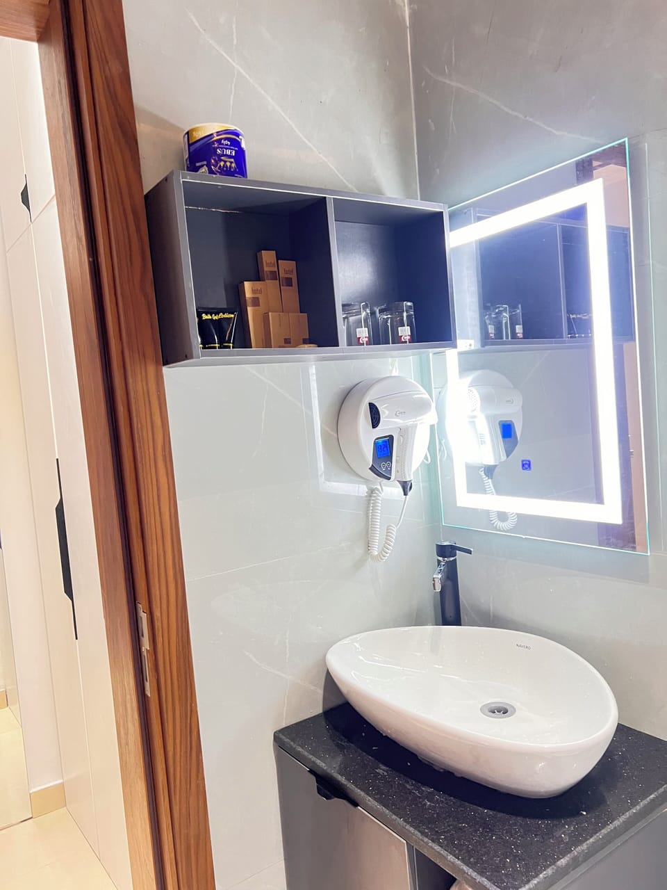 Shower, hair dryer, slippers, towels