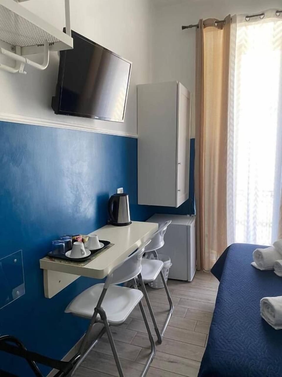 Double Room, Balcony, City View | Minibar, in-room safe, soundproofing, iron/ironing board