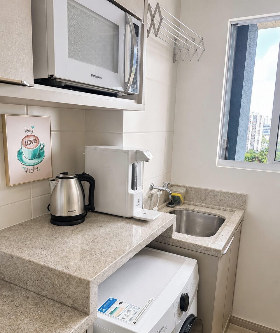 Premium Apartment, Pool Access, Beach View | Private kitchen | Dining table