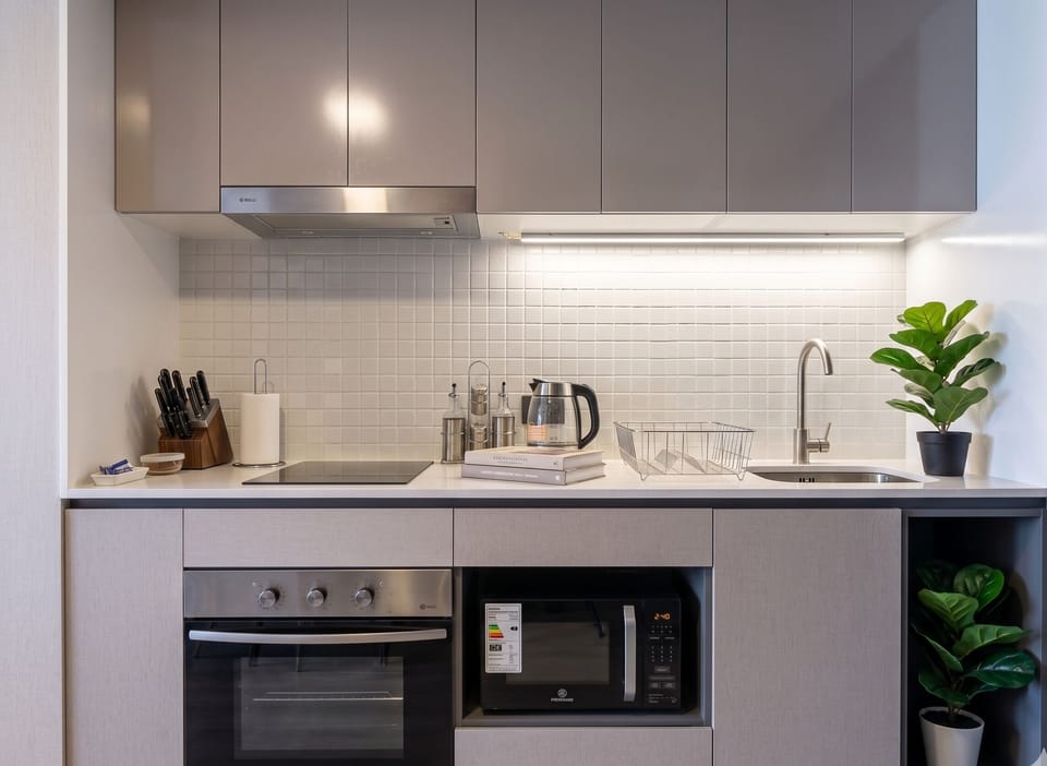 Apartment | Private kitchen | Full-size fridge, microwave, oven, cookware/dishes/utensils