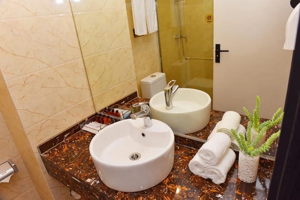 Family Studio, City View | Bathroom | Hair dryer, towels, soap, shampoo