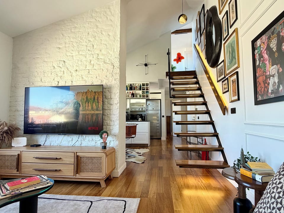 Apartment, Sea View | Living area | 65-inch LCD TV with satellite channels