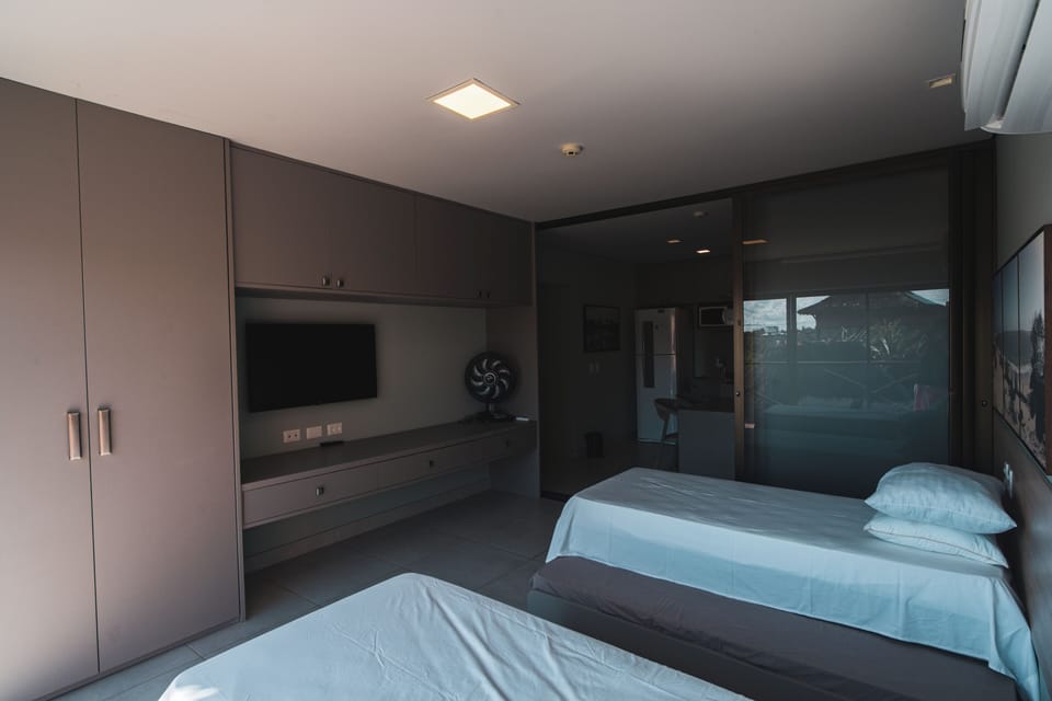 Deluxe Apartment, Pool View | Desk, laptop workspace