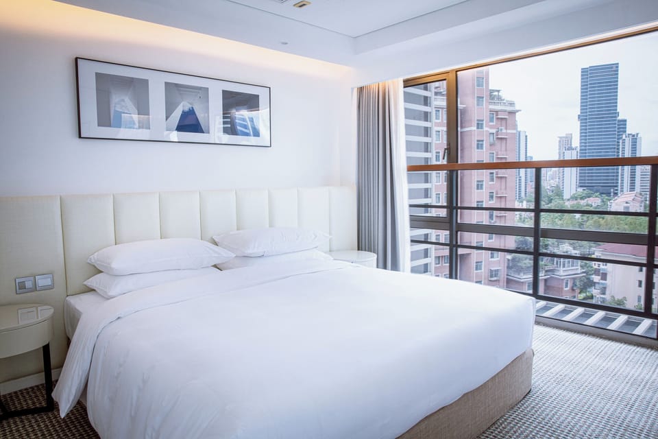 Classic Duplex, 1 Queen Bed, Kitchenette | In-room safe, blackout drapes, iron/ironing board, WiFi (free)