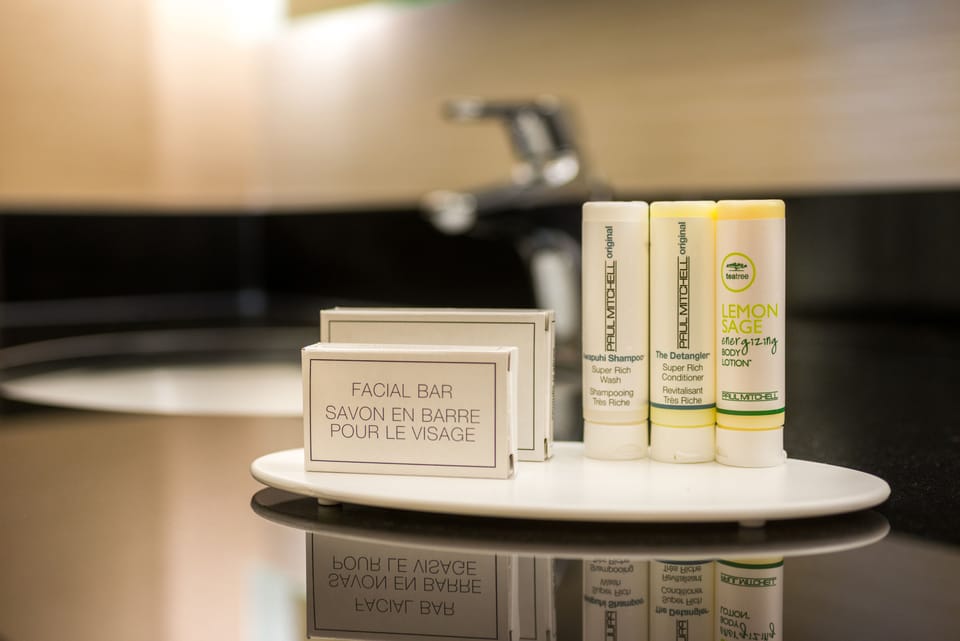 Designer toiletries, hair dryer, towels