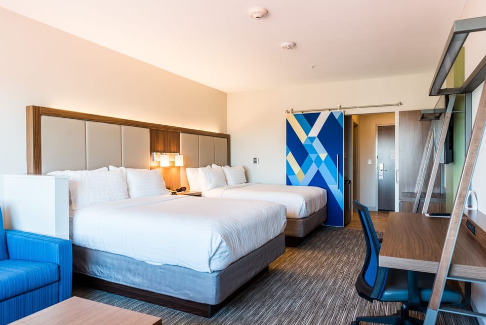 Suite, 2 Queen Beds | In-room safe, desk, laptop workspace, soundproofing