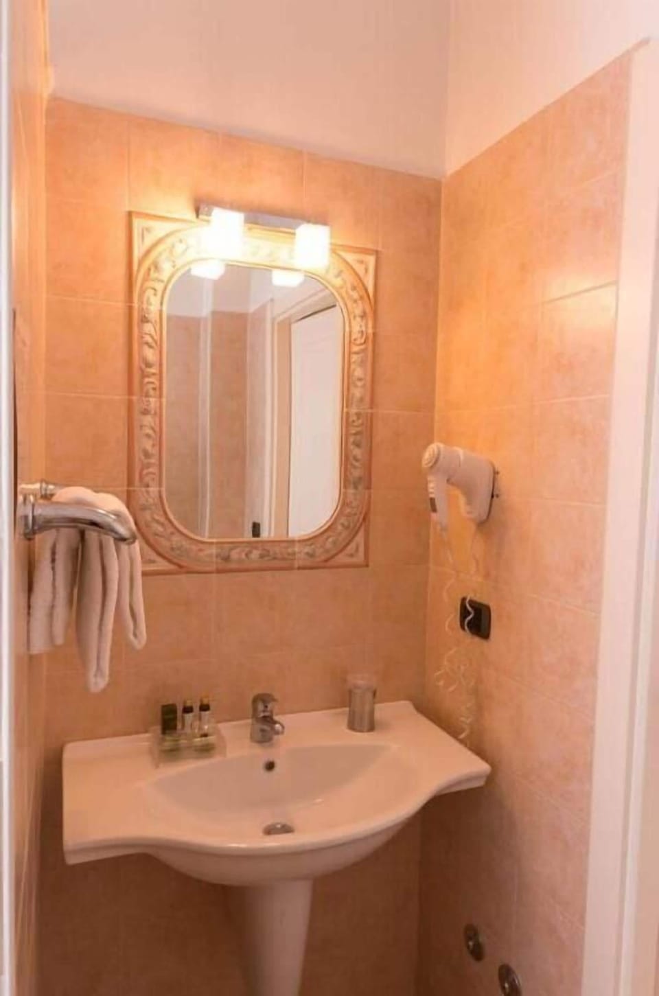 Shower, hair dryer, slippers, towels