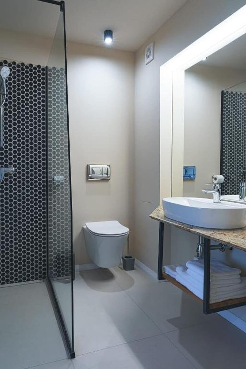 Shower, hair dryer, slippers, towels